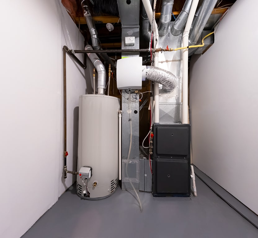 An area containing a water heater and upflow AC system