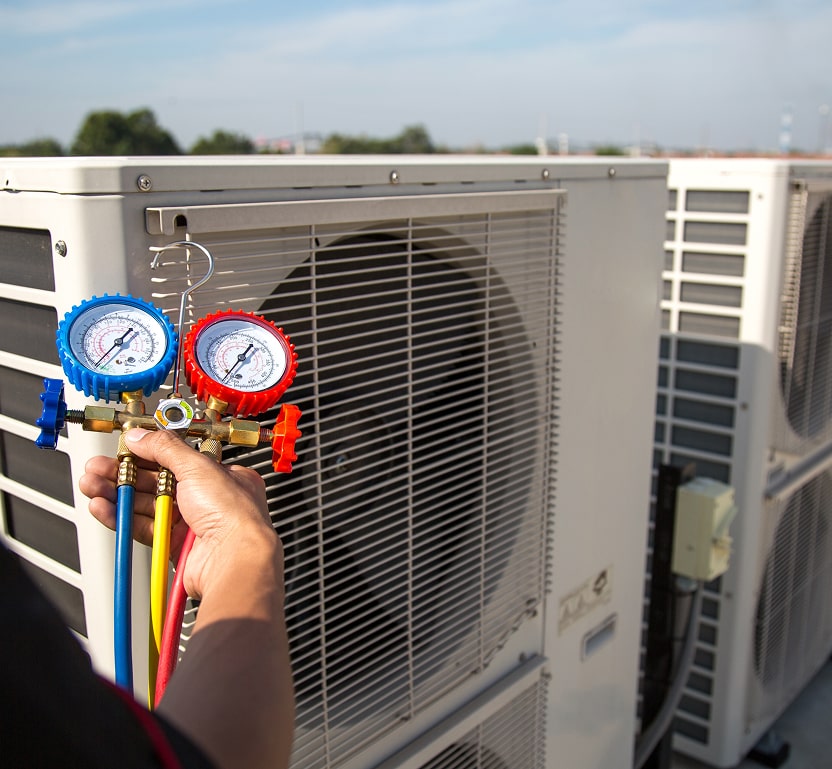 gauges being used on a commercial HVAC system on top of the roof.