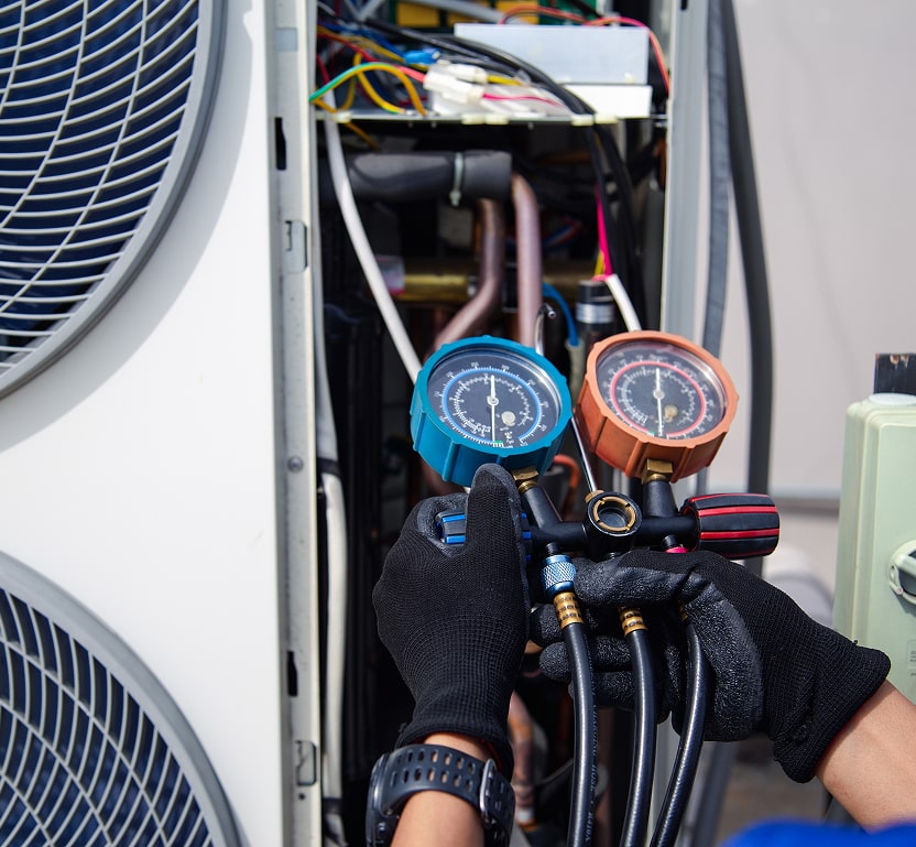 A closeup of gauges being used on an HVAC system