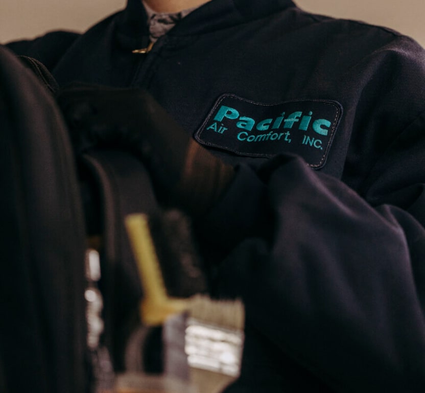 closeup of a Pacific Air Comfort patch on a workers shirt