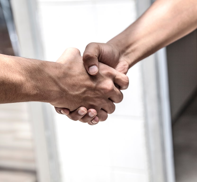 2 people shaking hands